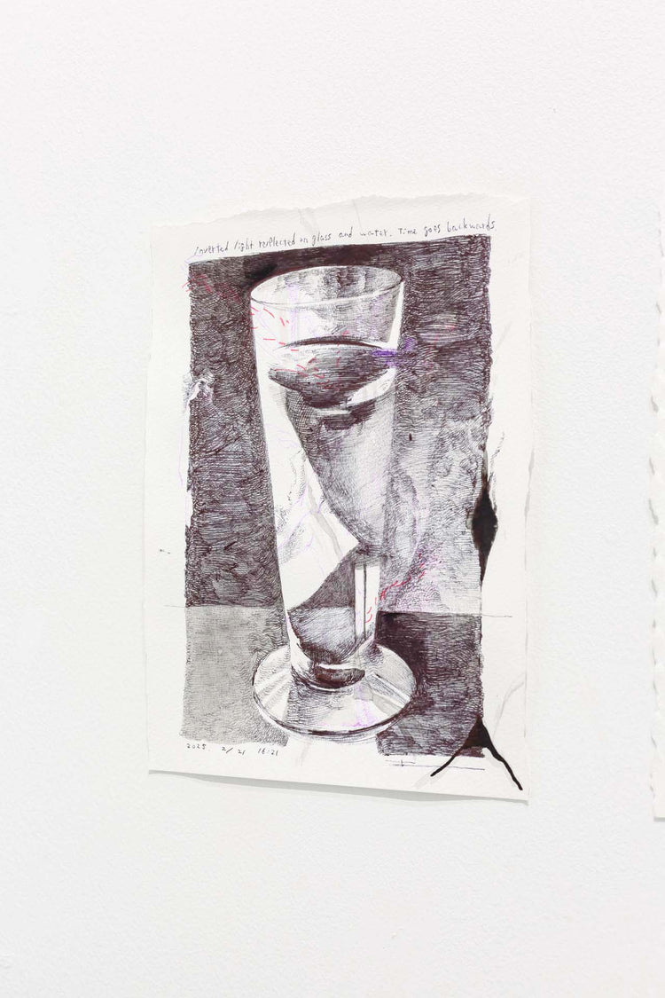 Inverted light reflected on glass and water. time goes backwards