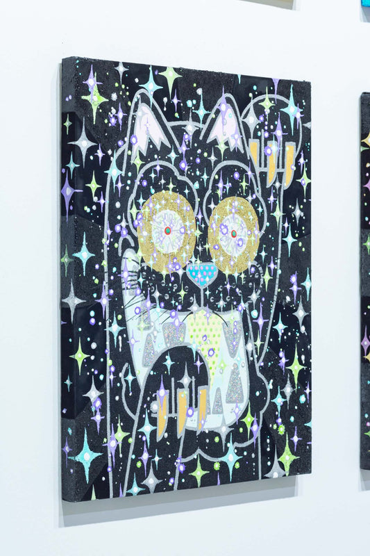 The black cat that is connected to the universe and continues to beckon