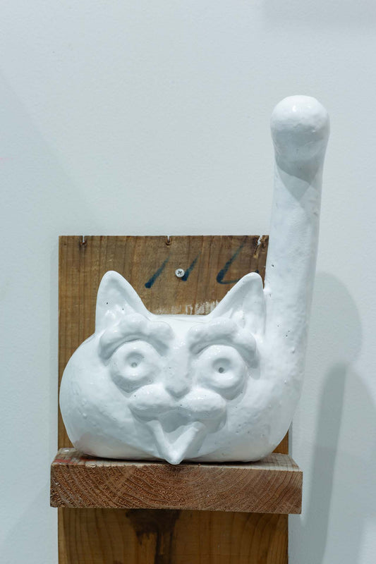 The white cat continues to beckon with its hands raised high