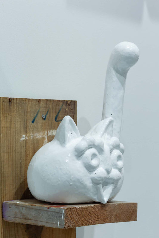 The white cat continues to beckon with its hands raised high